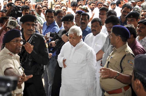 Indian politician and leader of Rashtriya Janata Dal, Lalu Prasad Yadav arrives at a special court held by Central Bureau of Investigation (CBI) for a verdict on fraudulent transfer of public money, in Ranchi, India, Monday, Sept. 30, 2013. Lalu was convicted by the court in the case, largely termed as fodder scam, where money was illegally withdrawn from the treasury by Animal Husbandry Department when he was the chief minister of the central Indian state of Bihar. The quantum of the sentence will be declared on Oct. 3. (AP Photo/Sasanka Sen)