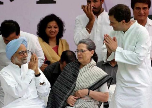 NEW DELHI, MAY 6 :- Former prime minister Manmohan Singh (L) is greeted by India's main opposition Congress party's vice-president Rahul Gandhi as the party's President Sonia Gandhi (C) looks on before what the party calls "Save Democracy" march to parliament in New Delhi, India, May 6, 2016. REUTERS-11R