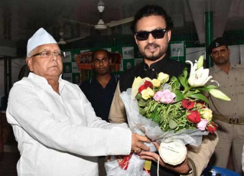 PATNA, JULY 7 (UNI):-RJD Chief Lalu Prasad greeting Bollywood actor Irrfan Khan on the occasion of Eid-ul-Fitr in Patna on Thursday. The actor was in town for the promotion his coming film 'Madari', on Thursday. UNI PHOTO-188U