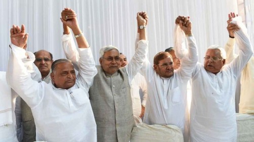 (L-R) Samajwadi Party chief Mulayam Singh Yadav, Nitish Kumar, chief minister of Bihar, Sharad Yadav of the Janata Dal (United) party, Lalu Prasad Yadav of Rashtriya Janata Dal party pose for photographers ahead of a press conference in New Delhi on April 15, 2015. Six Indian left-leaning and regional political parties vowed to work together to take on Prime Minister Narendra Modi's right-wing Bharatiya Janata Party ahead of key Bihar state elections scheduled later in the year. AFP PHOTO / SAJJAD HUSSAIN