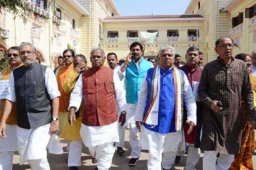 Patna: NDA legislators taking out a Raj Bhawan march during protest against Bihar's minister for excise and prohibition Abdul Jalil Mastan's remarks on PM Narendra Modi, at budget session in Patna on Thursday. UNI photo by- Pappi Sharma.